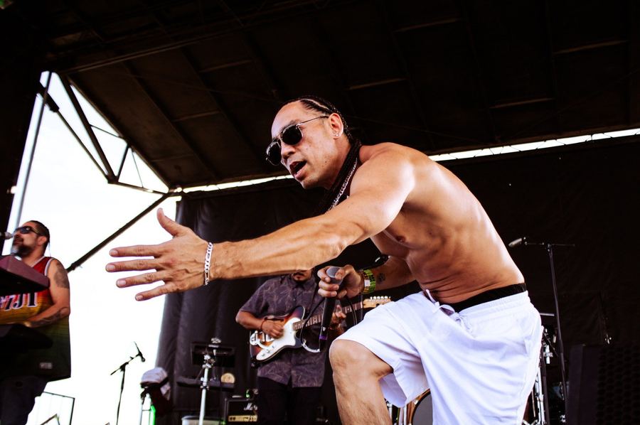 Kekoa reaching toward the crowd mid-song at Mission Bayfest
